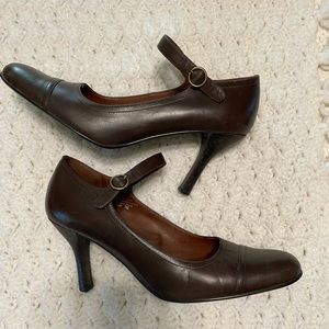 Alfani heels in a Mary Jane style have a strap that buckles at the side.